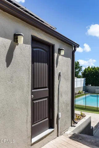 a view of a door and a window