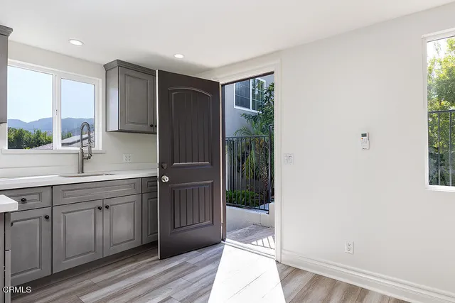 a bathroom with a double vanity sink and mirror