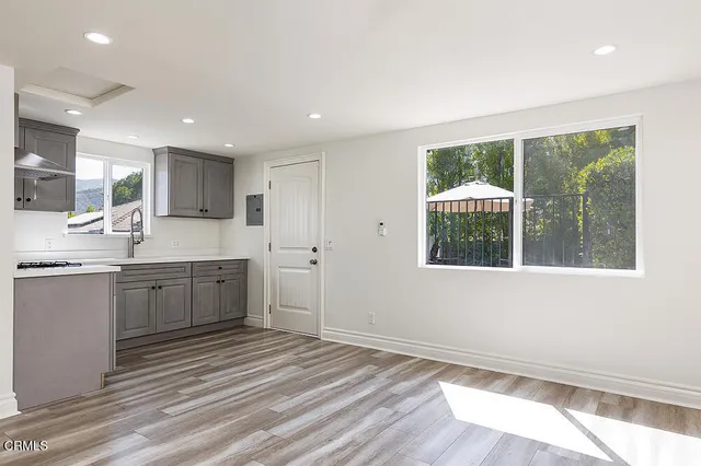 a large kitchen with a large window