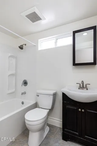 a bathroom with a sink toilet and a bathtub
