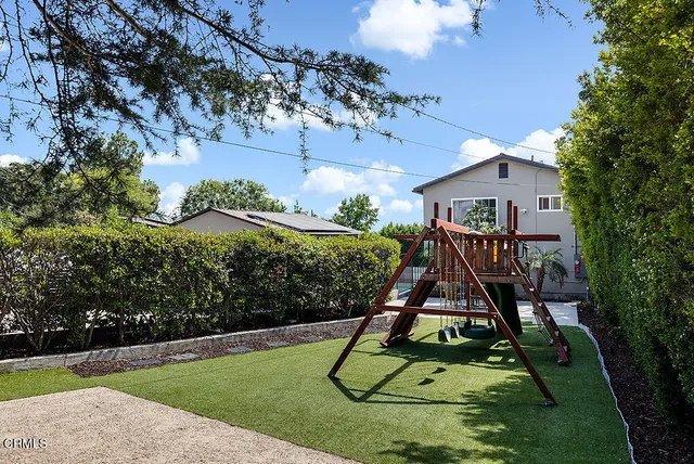 a view of playground with a slide
