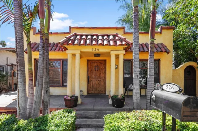 a front view of a building with outdoor seating