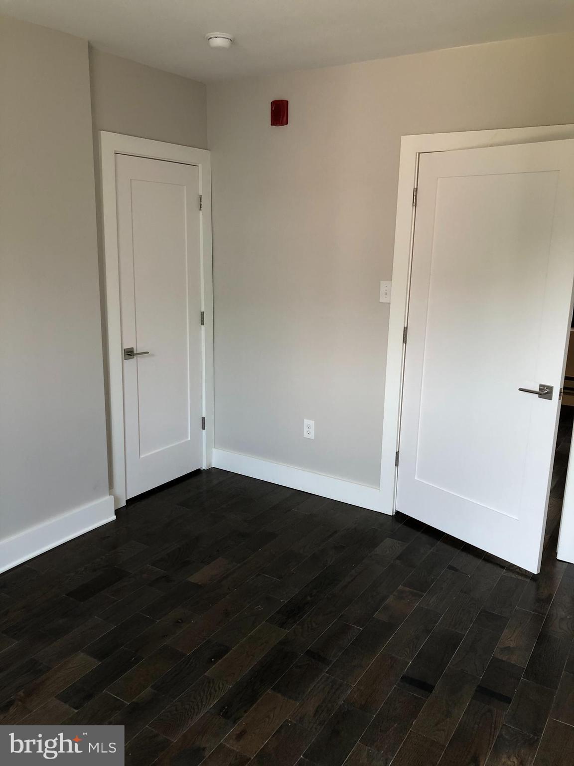 5101-7 North 12th Street, Unit 3C Philadelphia, PA 19141 - Photo 2 of 6 a view of an empty room with wooden floor