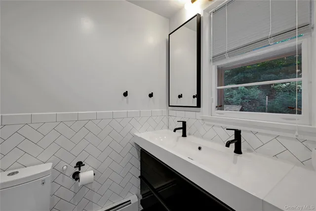 a bedroom with a bed and cabinet