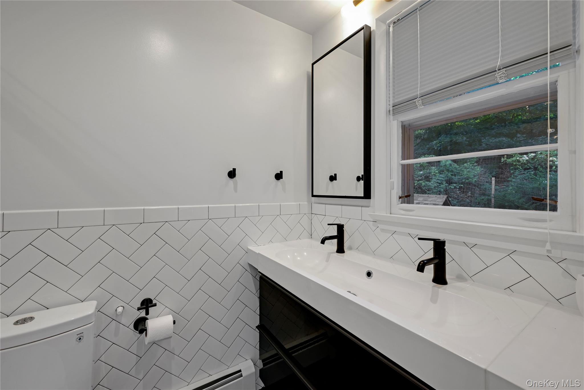 47 Mountainview Drive Tomkins Cove, NY 10986 - Photo 16 of 39 a bathroom with a sink and a mirror