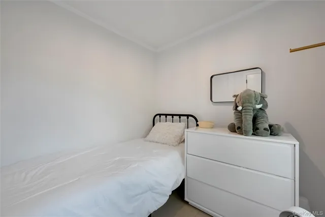 a room with a bed and a window