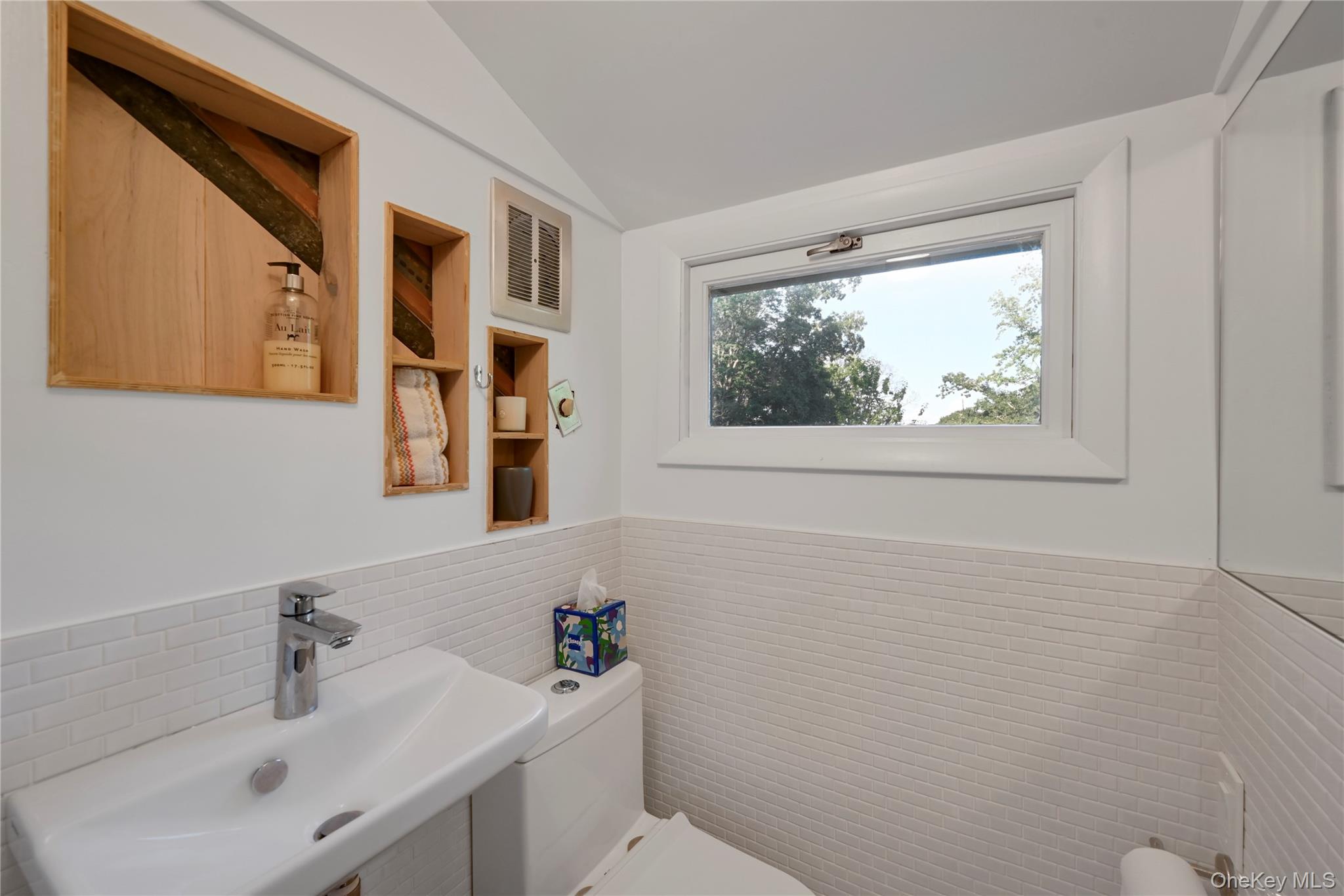 47 Mountainview Drive Tomkins Cove, NY 10986 - Photo 27 of 39 a bathroom with a sink mirror and toilet