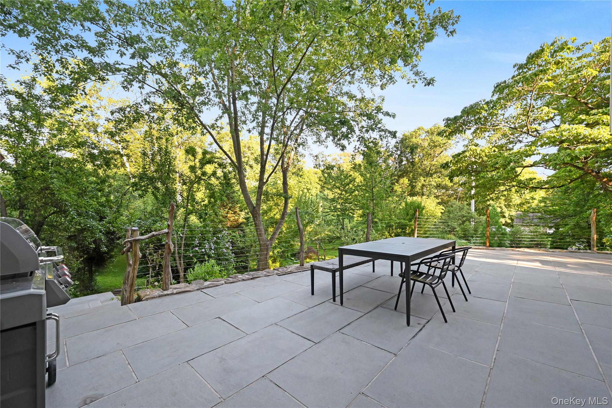 47 Mountainview Drive Tomkins Cove, NY 10986 - Photo 33 of 39 a backyard of a house with table and chairs