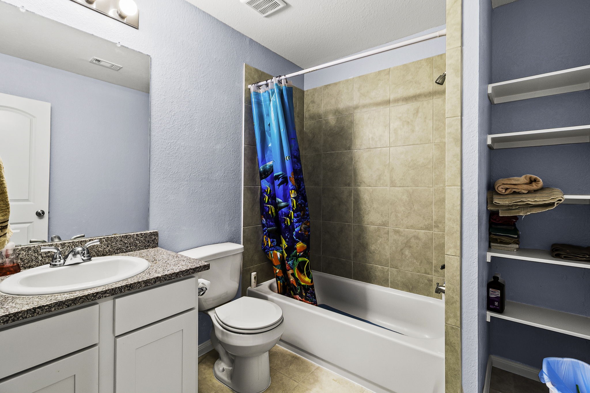 155 Cherry Tree Livingston, TX 77351 - Photo 10 of 30 a bathroom with a sink a toilet and shower