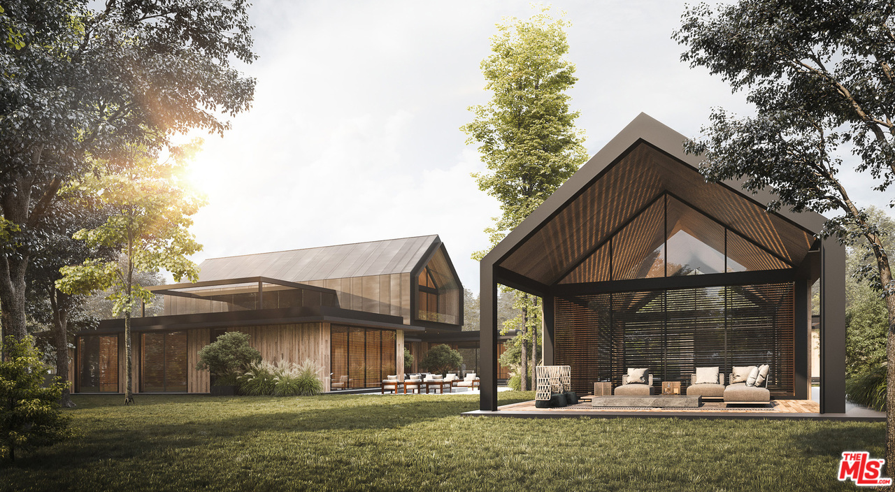 10895 Chalon Road Los Angeles, CA 90077 - Photo 11 of 19 a front view of a house with garden