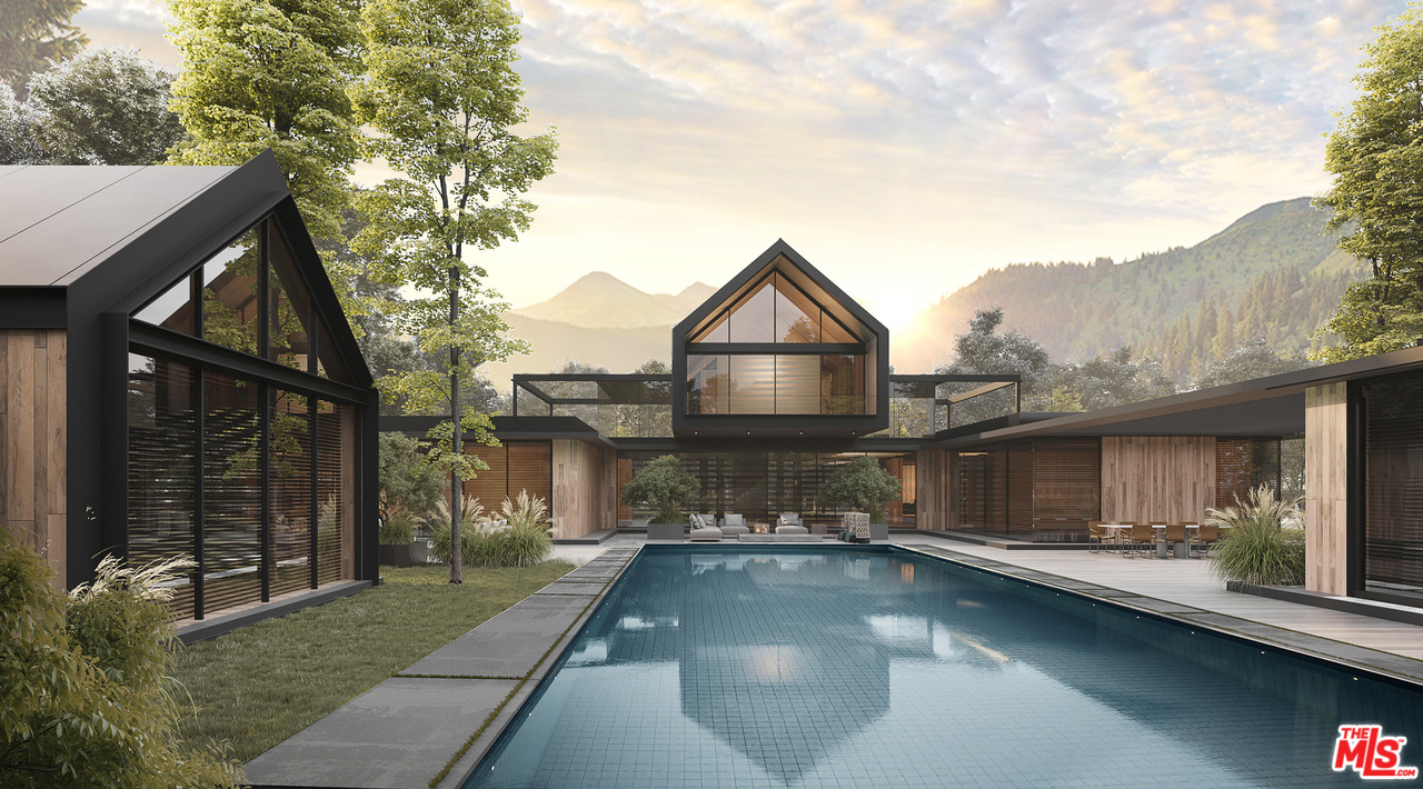 10895 Chalon Road Los Angeles, CA 90077 - Photo 13 of 19 a view of a house with backyard and sitting area