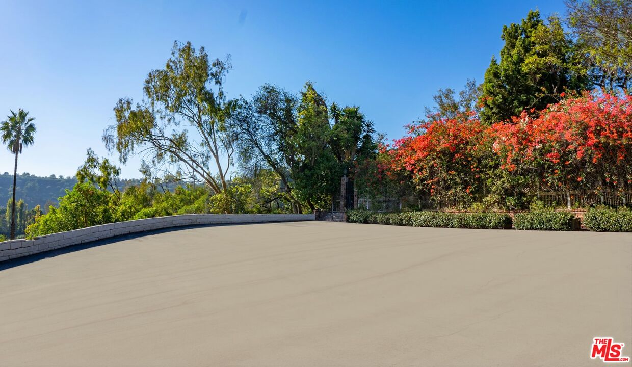 10895 Chalon Road Los Angeles, CA 90077 - Photo 17 of 19 a view of an outdoor space and trees