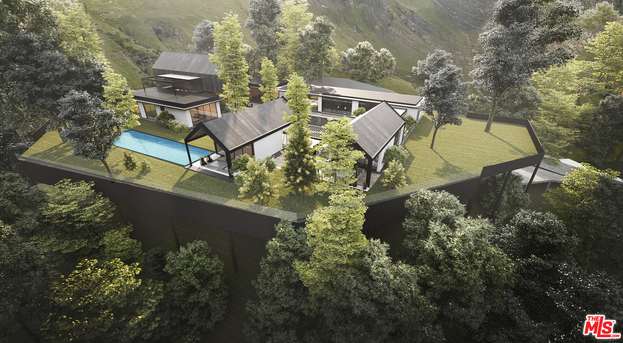 10895 Chalon Road Los Angeles, CA 90077 - Photo 5 of 19 an aerial view of a house with a yard and garden