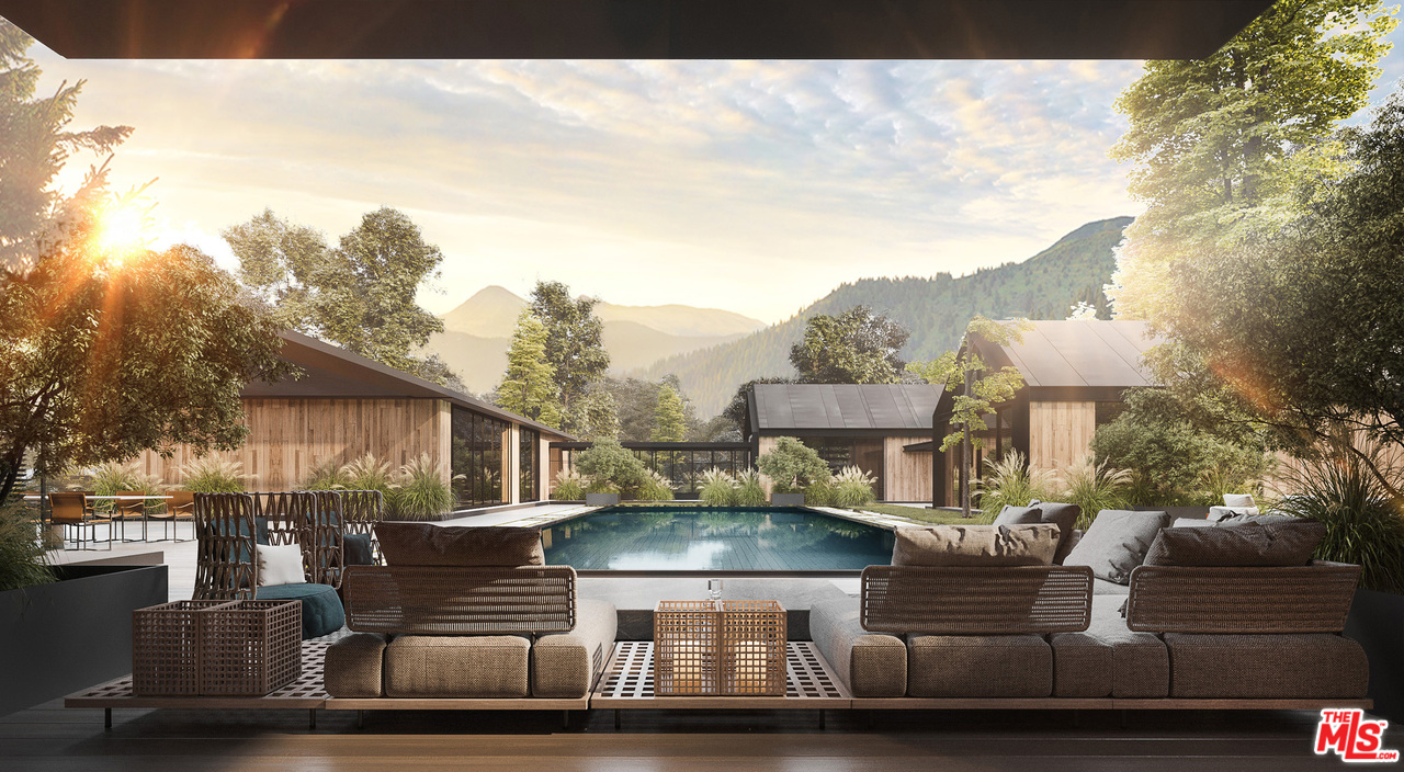 10895 Chalon Road Los Angeles, CA 90077 - Photo 7 of 19 a front view of a house with a yard