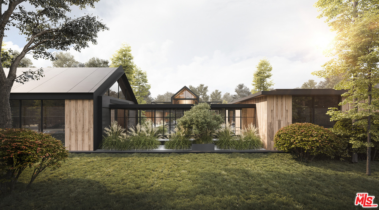 10895 Chalon Road Los Angeles, CA 90077 - Photo 9 of 19 a front view of a house with garden