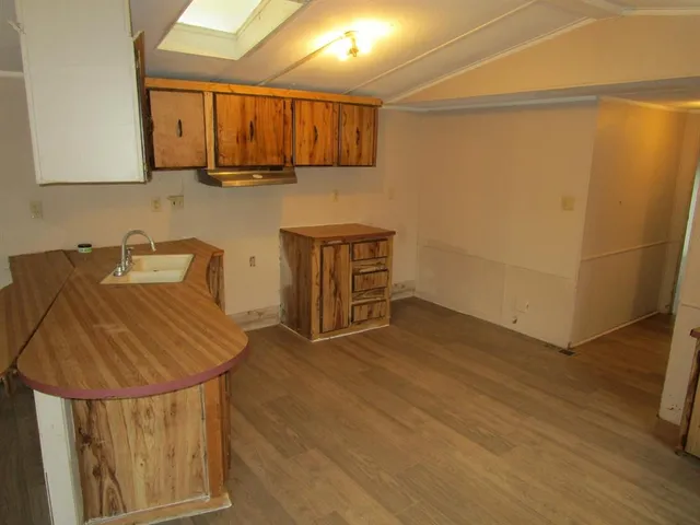 a kitchen with a sink and cabinets