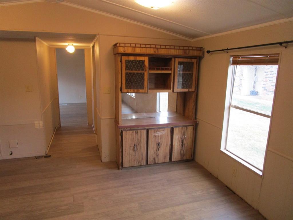 800 Bluff Street Sweetwater, TX 79556 - Photo 13 of 19 an empty room with windows