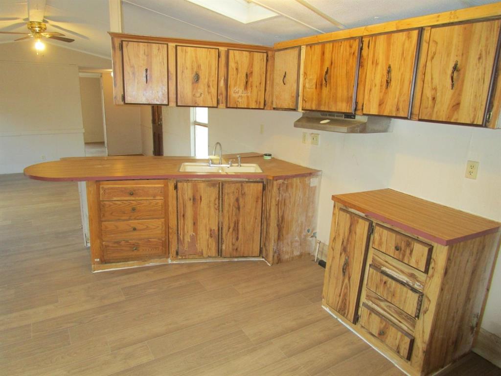 800 Bluff Street Sweetwater, TX 79556 - Photo 14 of 19 a bathroom with a sink and a mirror