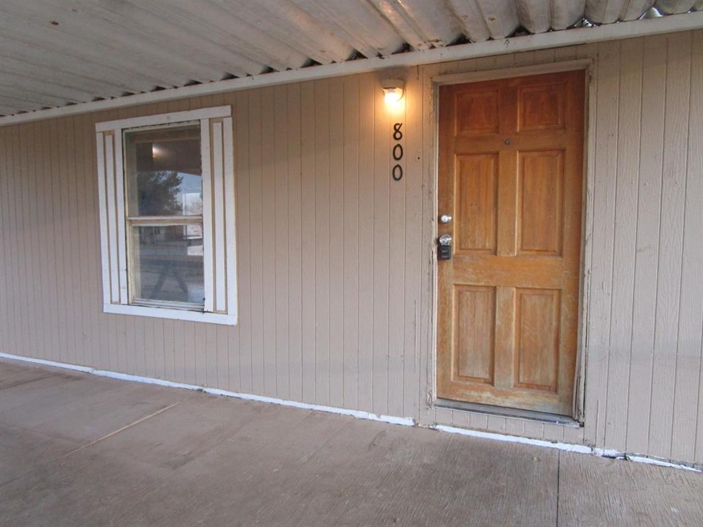 800 Bluff Street Sweetwater, TX 79556 - Photo 6 of 19 an empty room with windows