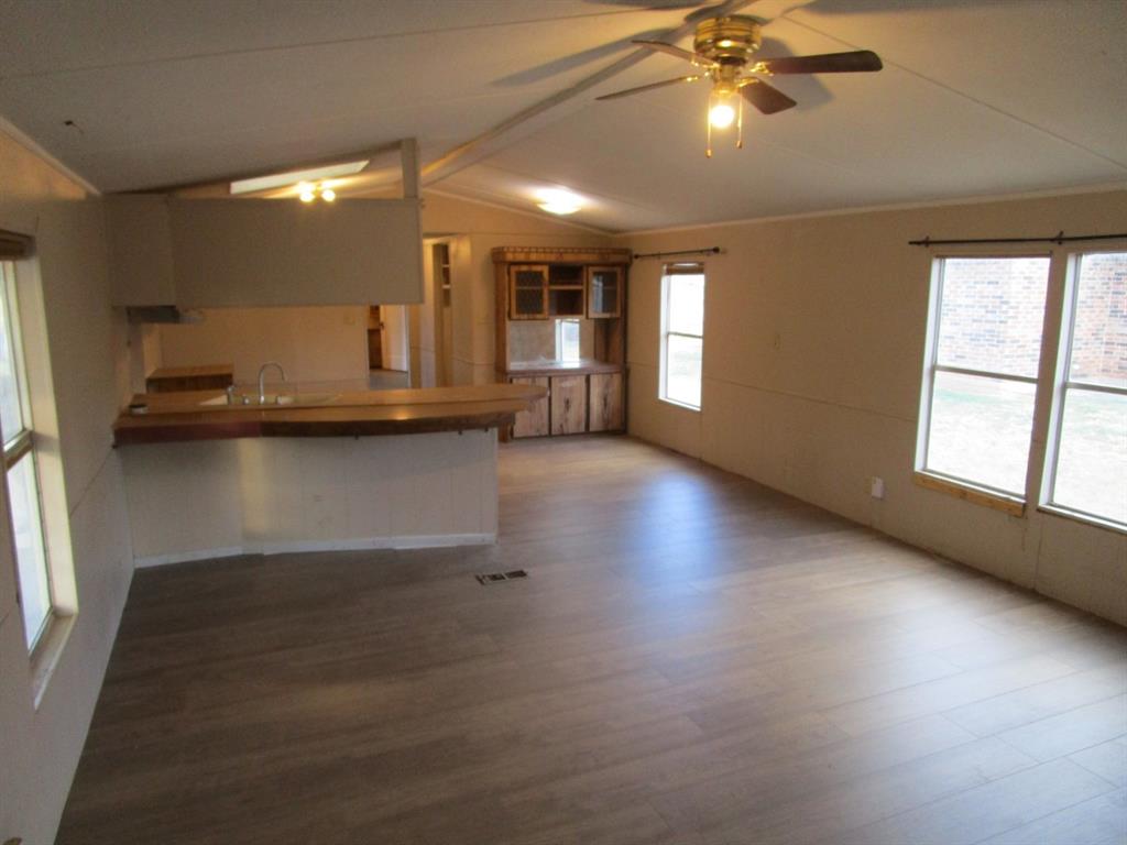 800 Bluff Street Sweetwater, TX 79556 - Photo 7 of 19 a view of a livingroom with furniture wooden floor and a window