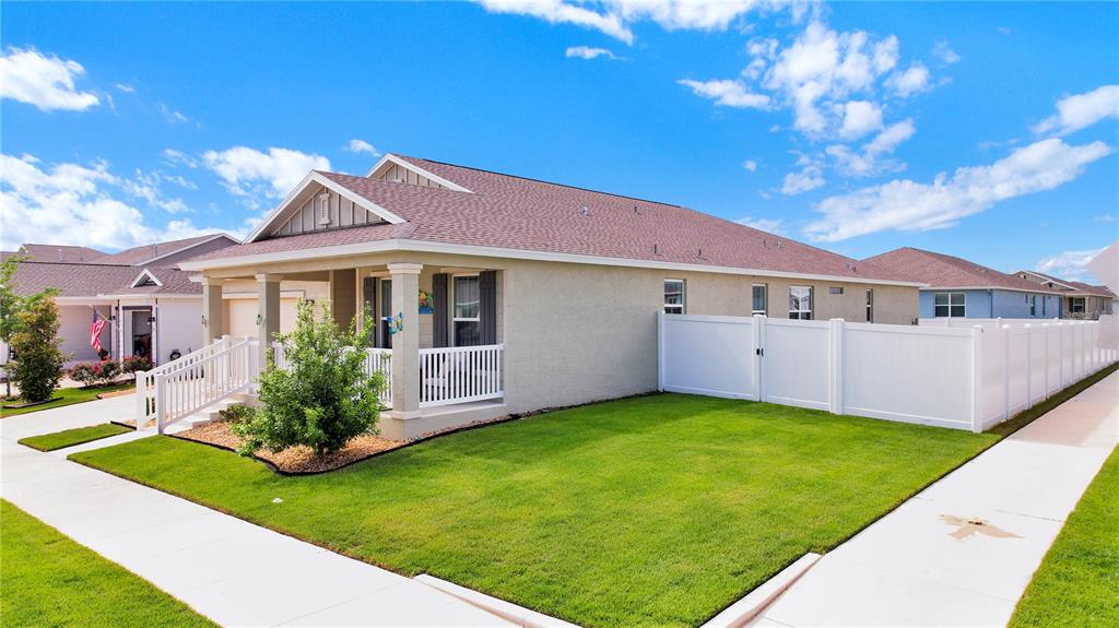 7185 Southwest 63rd Street Ocala, FL 34474 - Photo 2 of 31 a front view of house with yard and green space