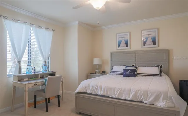 a bedroom with a bed and a chair