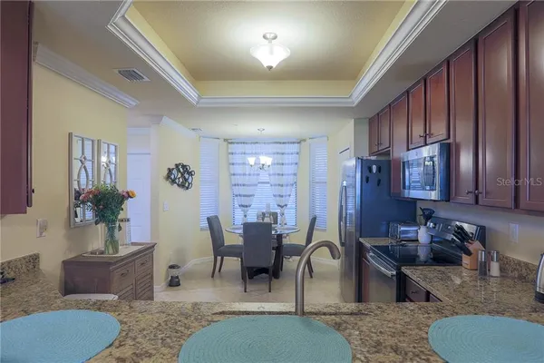 a living room with furniture rug and window
