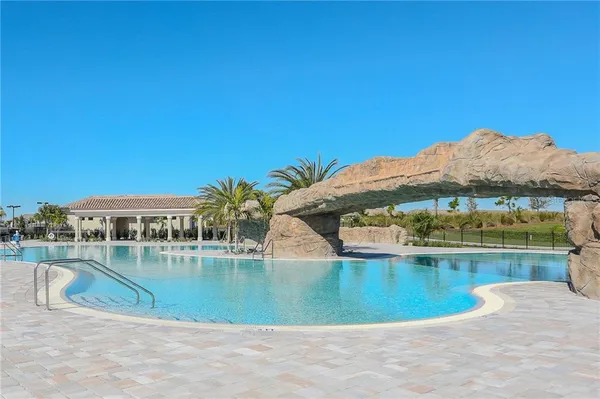 a view of a swimming pool with a lake view
