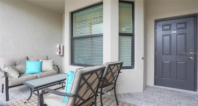 a living room with furniture and a window