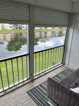 a view of a balcony with wooden floor