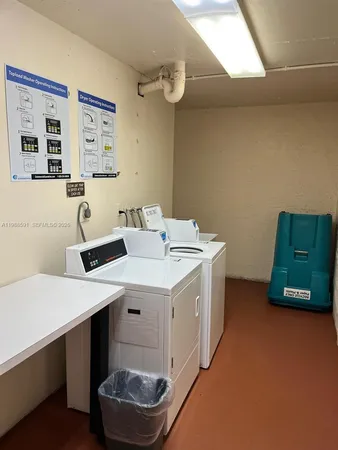 a utility room with a sink a refrigerator and a stove