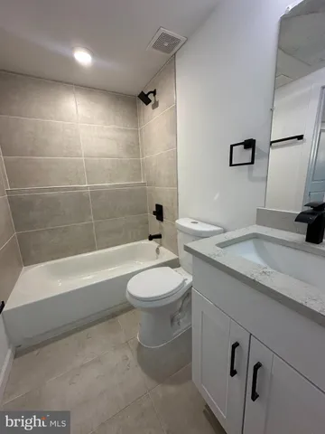 a view of a house with backyard porch and sitting area