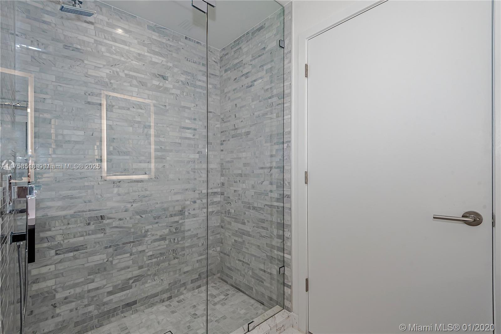851 Northeast 1st Avenue, Unit 2600 Miami, FL 33132 - Photo 23 of 24 a bathroom with a shower