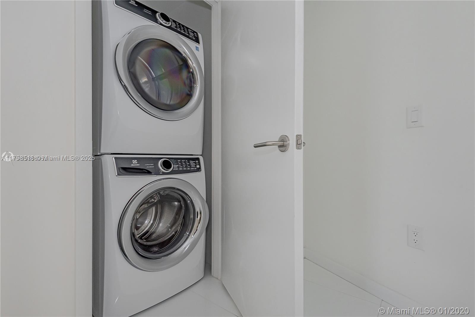 851 Northeast 1st Avenue, Unit 2600 Miami, FL 33132 - Photo 24 of 24 a utility room with dryer and washer