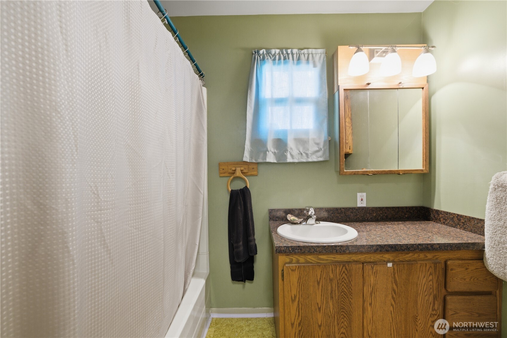 231 Main Street Waitsburg, WA 99361 - Photo 14 of 35 a bathroom with a sink and a mirror