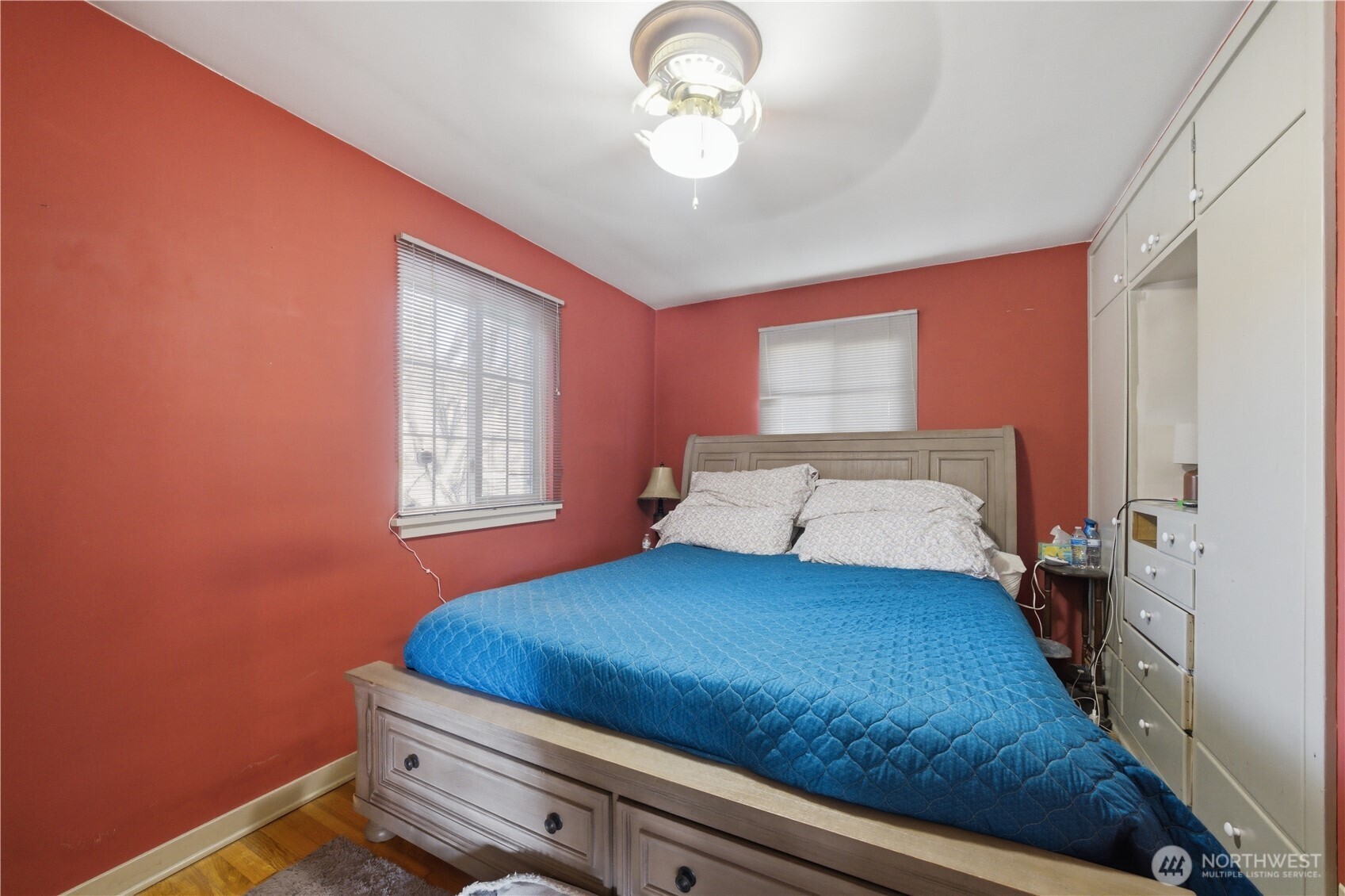 231 Main Street Waitsburg, WA 99361 - Photo 9 of 35 a bedroom with a bed and a chandelier