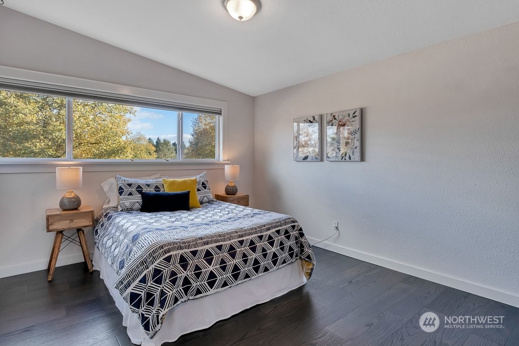 9203 29th Avenue Southwest Seattle, WA 98126 - Photo 12 of 25 a bedroom with a bed and window