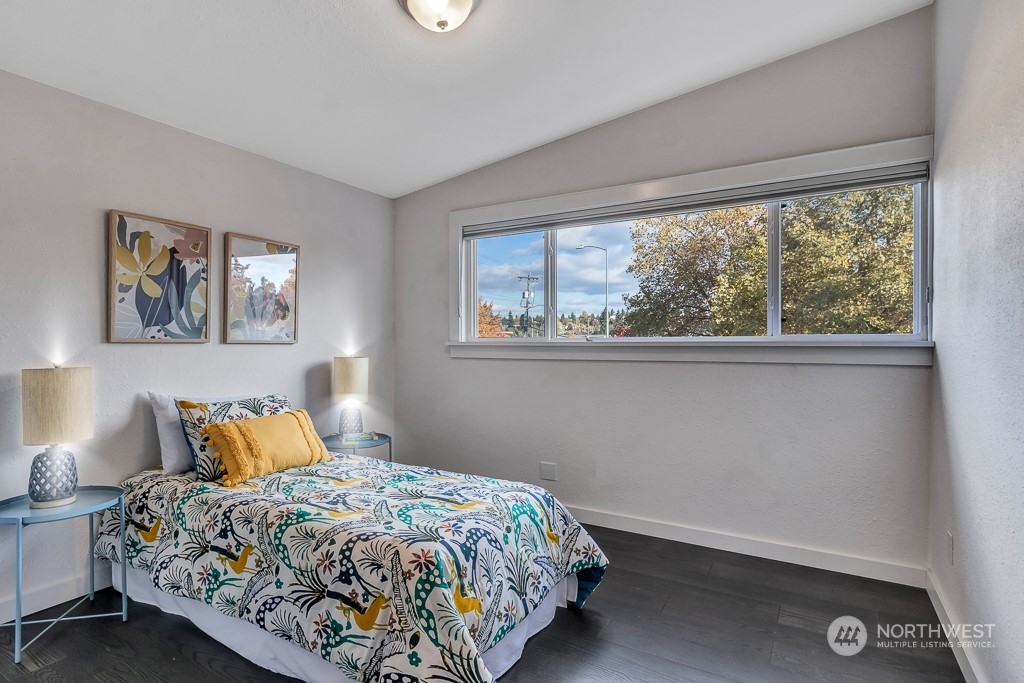 9203 29th Avenue Southwest Seattle, WA 98126 - Photo 14 of 25 a bedroom with a bed and window