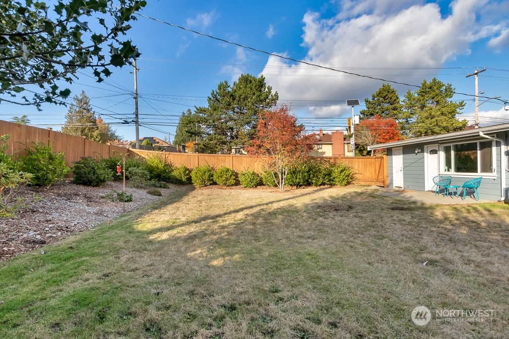 9203 29th Avenue Southwest Seattle, WA 98126 - Photo 23 of 25 a view of a house with a backyard