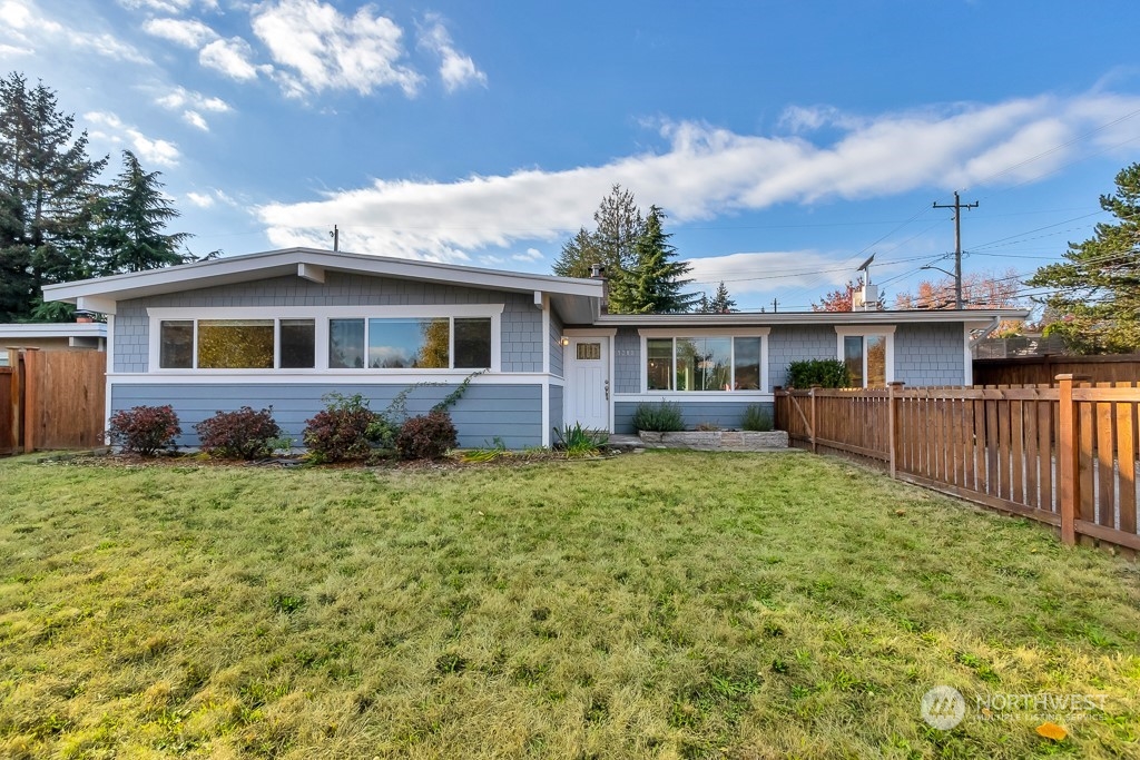 9203 29th Avenue Southwest Seattle, WA 98126 - Photo 25 of 25 a front view of a house with a yard