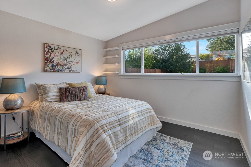 9203 29th Avenue Southwest Seattle, WA 98126 - Photo 10 of 25 a bedroom with a large bed and a window