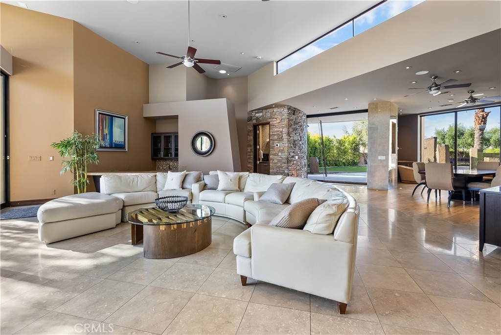 68 Royal St Georges Way Rancho Mirage, CA 92270 - Photo 41 of 75 a living room with furniture and a large window