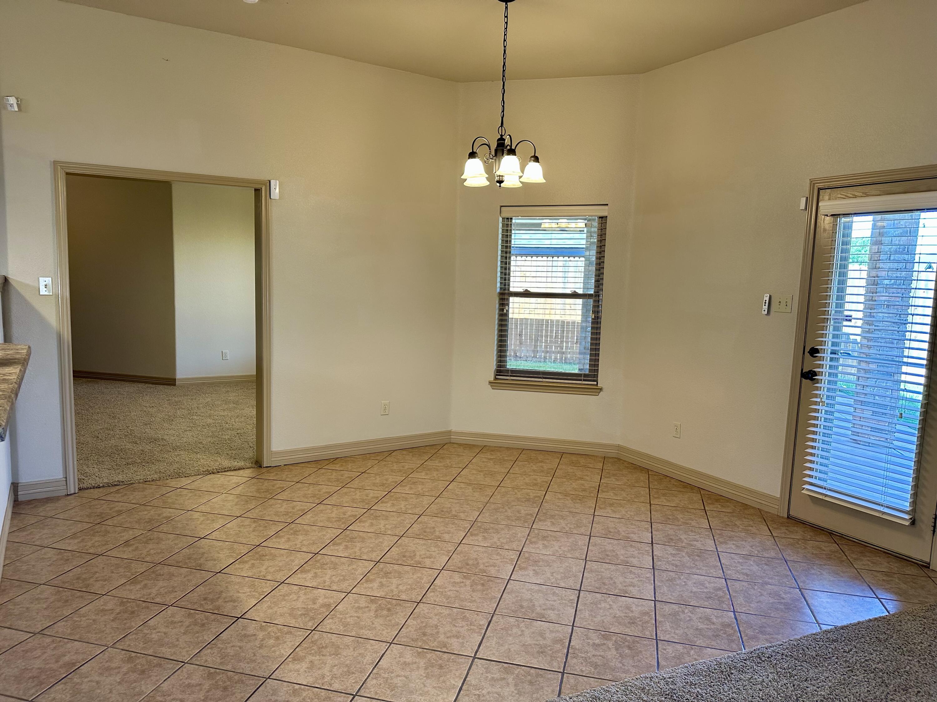 6114 75th Place Lubbock, TX 79424 - Photo 12 of 35 a view of an empty room with a window