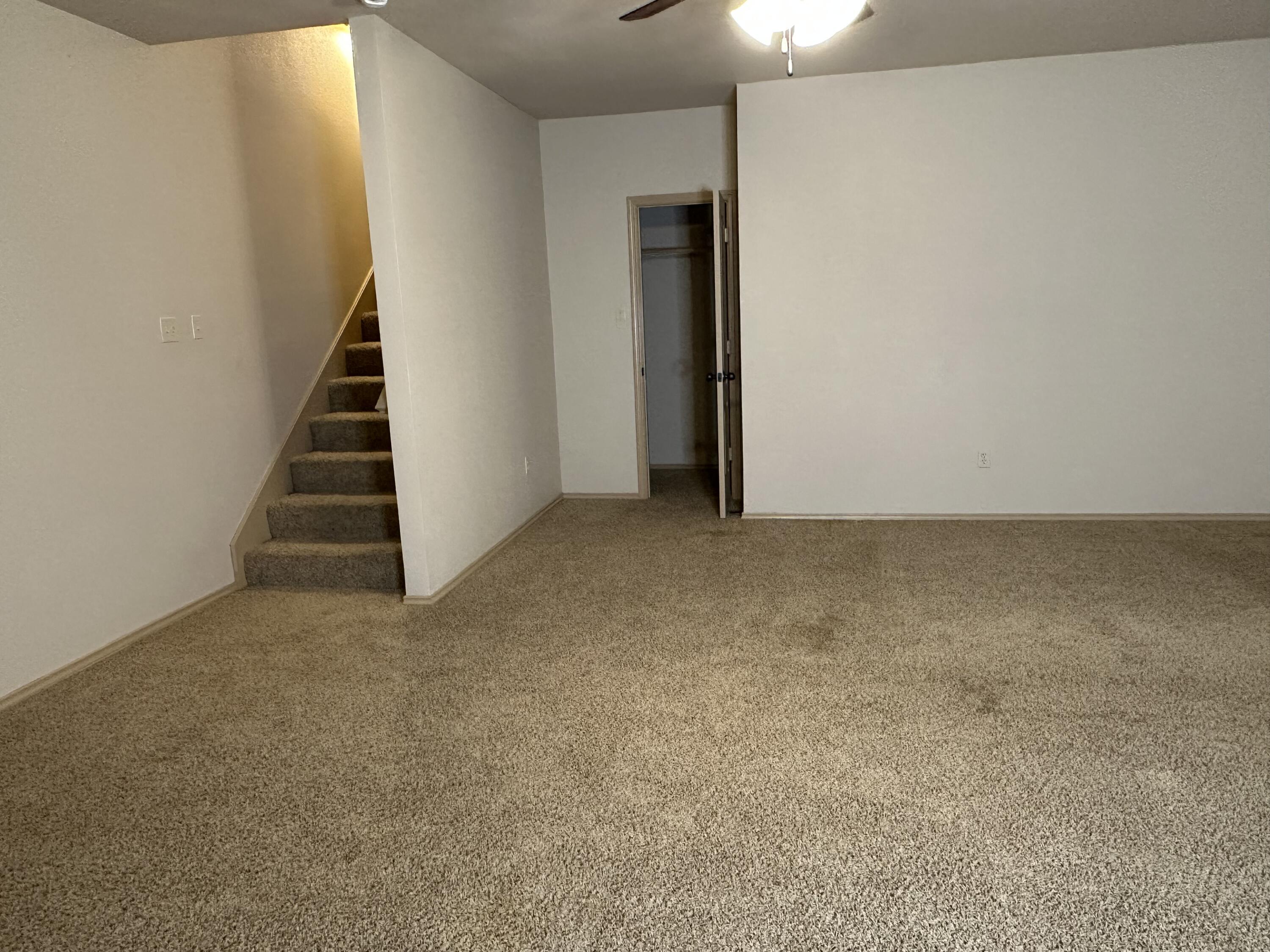 6114 75th Place Lubbock, TX 79424 - Photo 14 of 35 a view of an empty room with stairs