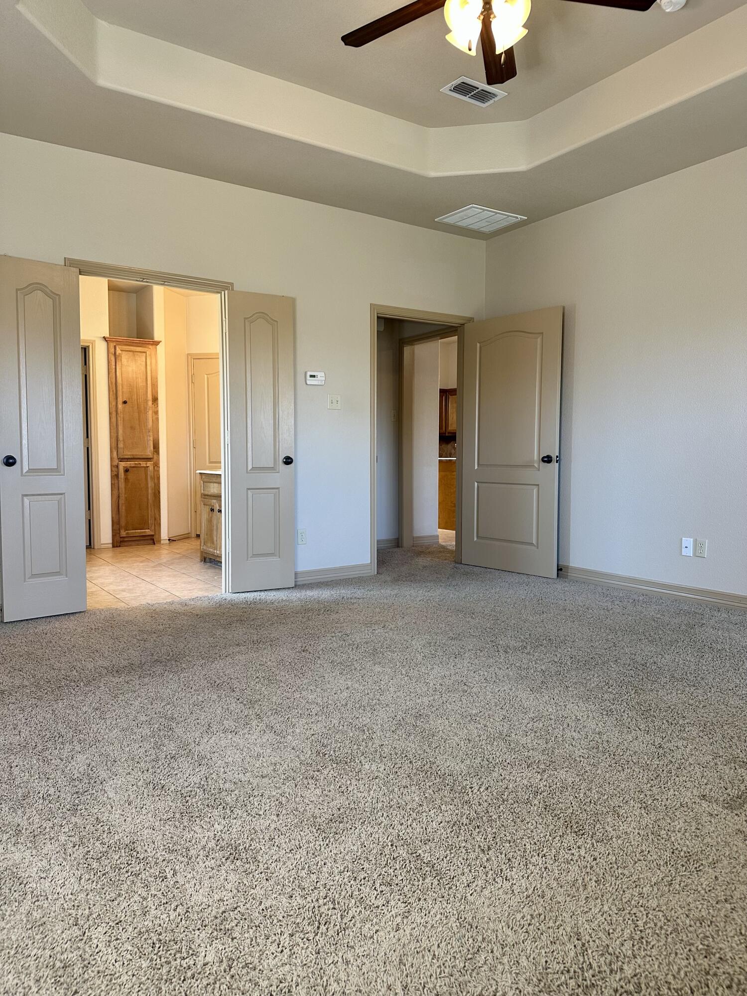6114 75th Place Lubbock, TX 79424 - Photo 18 of 35 a view of empty room with a fireplace