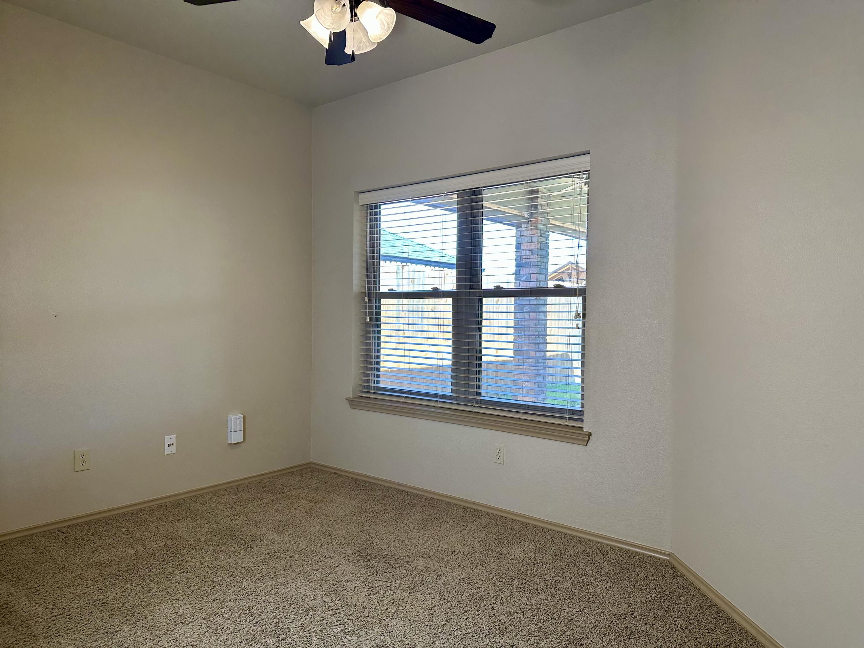 6114 75th Place Lubbock, TX 79424 - Photo 28 of 35 an empty room with a window