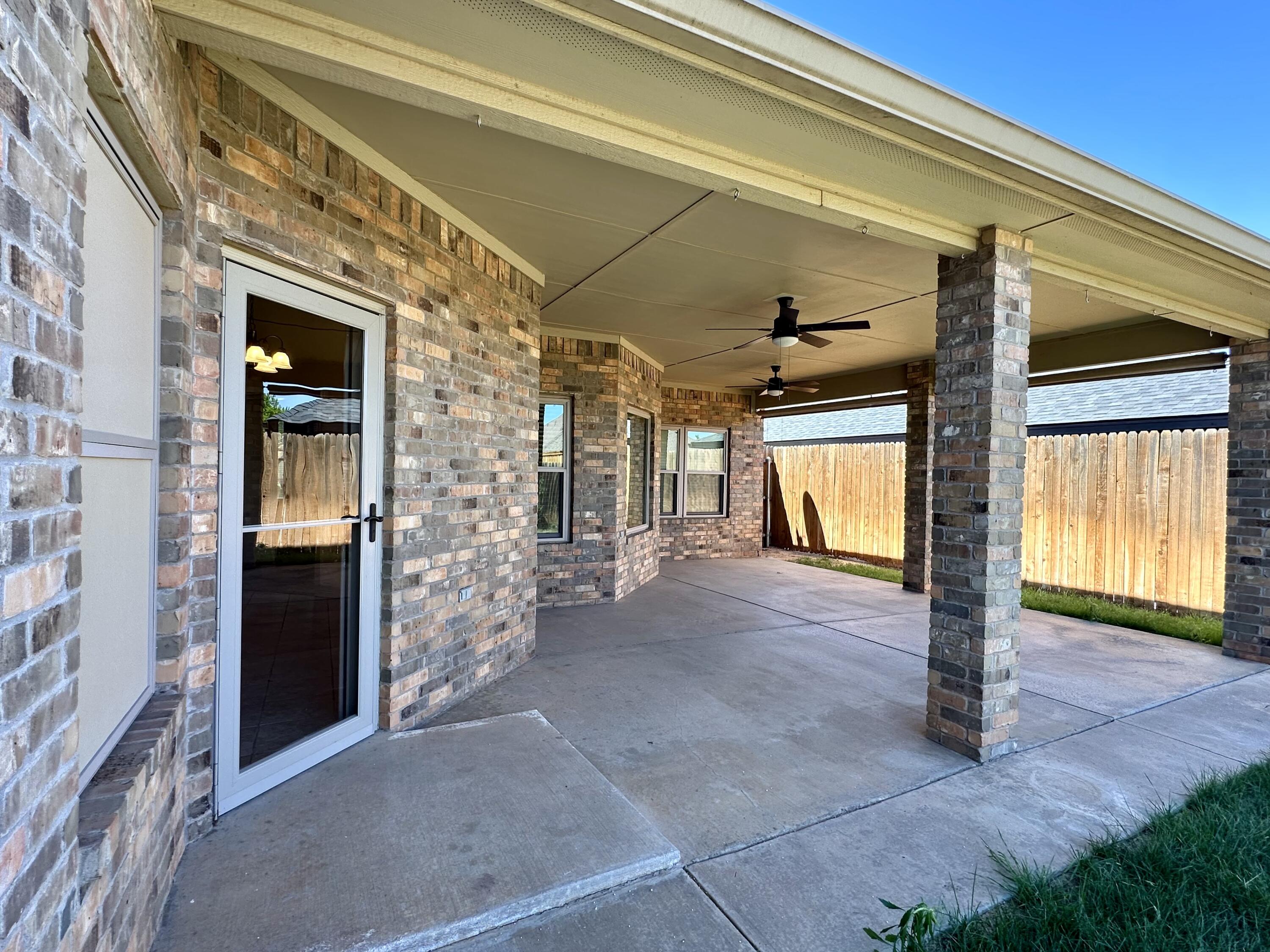 6114 75th Place Lubbock, TX 79424 - Photo 33 of 35 a view of a porch door