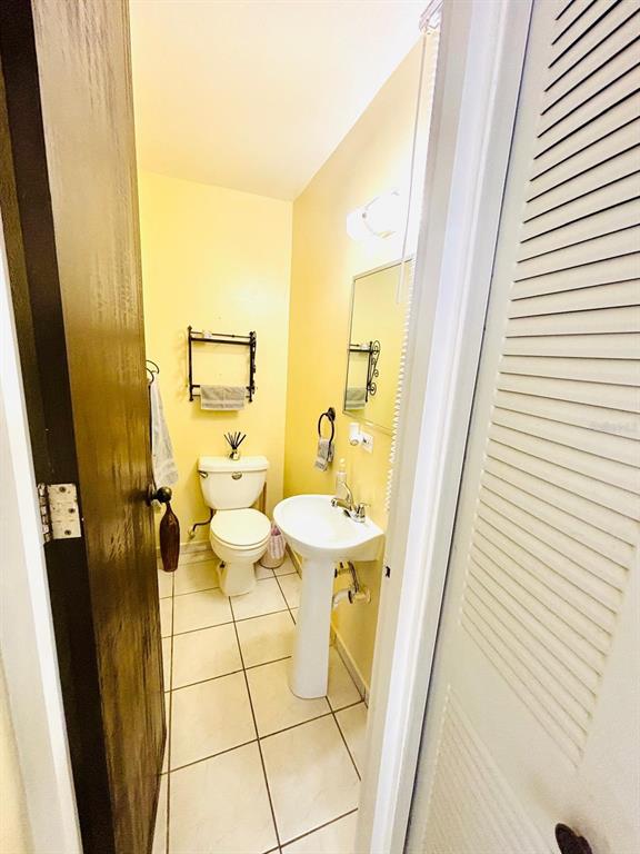 1 St Rio Grande, Unit B6 Rio Grande, PR 00745 - Photo 20 of 47 a bathroom with a sink and mirror with toilet