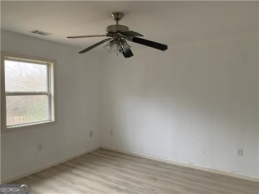 838 Racetrack Road Toccoa, GA 30577 - Photo 7 of 7 an empty room with a window