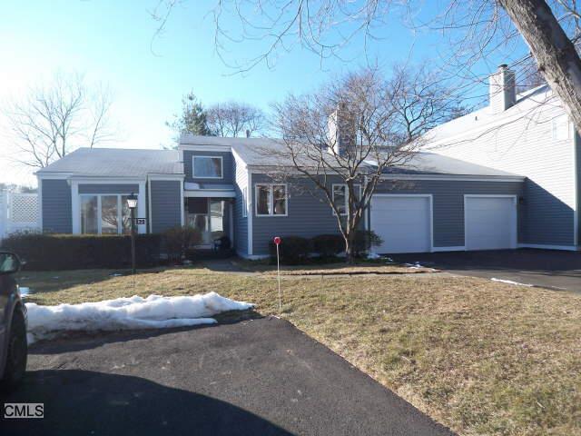 83 Field Point Drive, Unit 83 Fairfield, CT 06824 - Photo 1 of 1 a view of a house with a yard